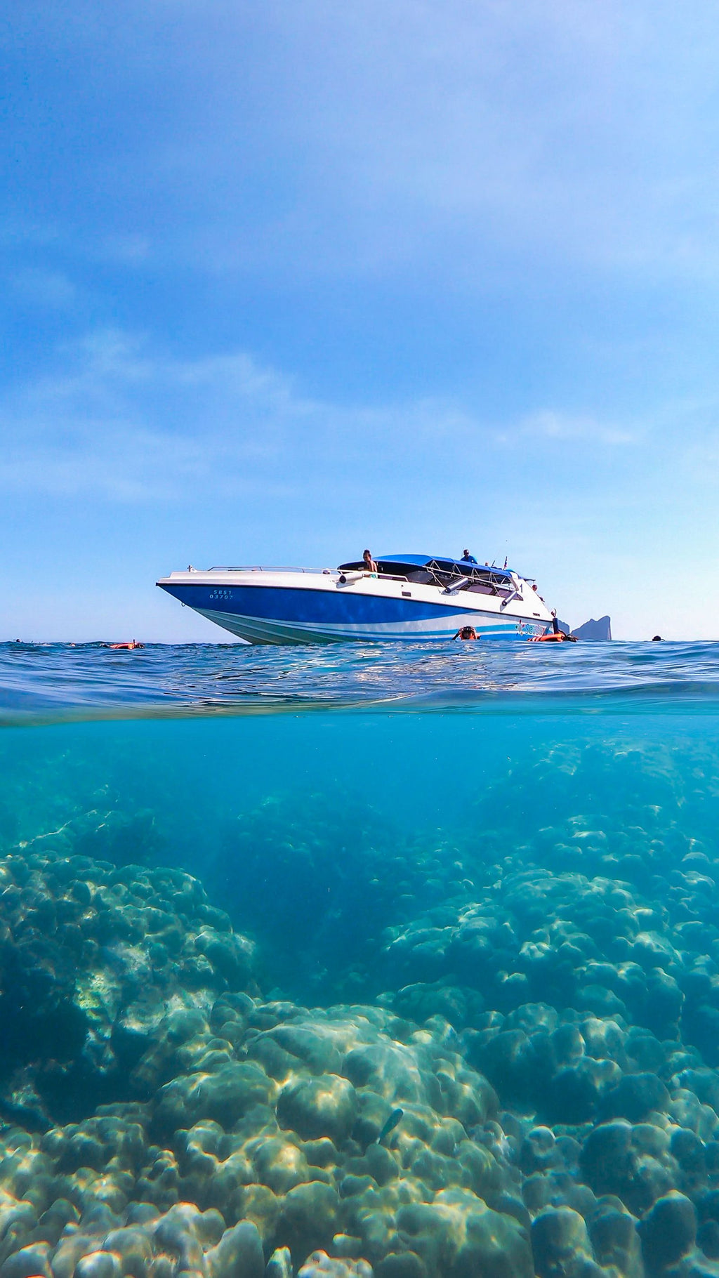 Speedboat over coral reef at Koh Phi Phi