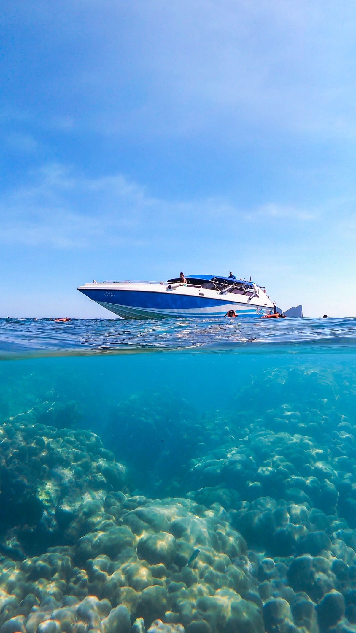 Speedboat over coral reef at Koh Phi Phi