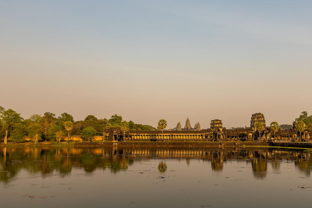 Angkor Wat reflected in the water at sunrise