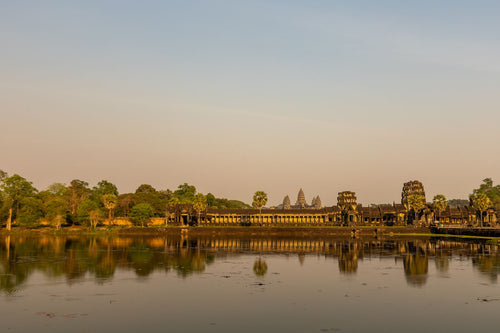 Angkor Wat reflected in the water at sunrise
