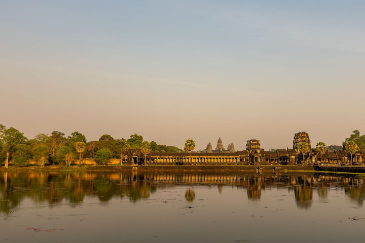 Angkor Wat reflected in the water at sunrise