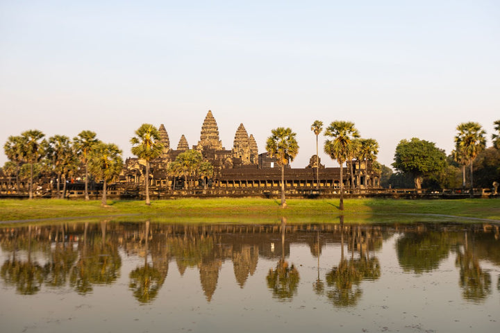 Angkor Wat reflected in the water in daylight