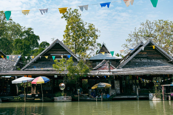 Floating market with boats and umbrellas