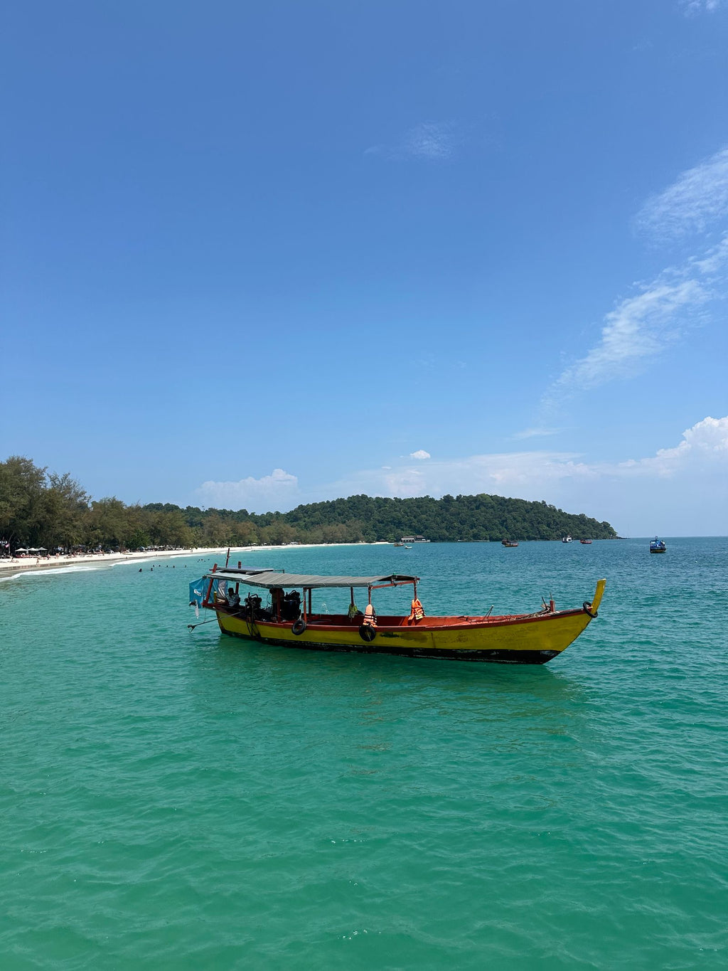 Tropical beach with a traditional boat
