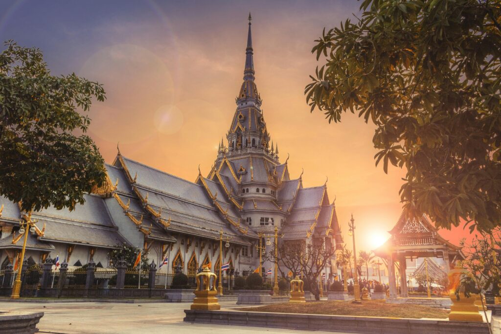 Home Scenic view of Wat Sothonwararam Temple during sunset in Thailand, capturing its beautiful architecture.